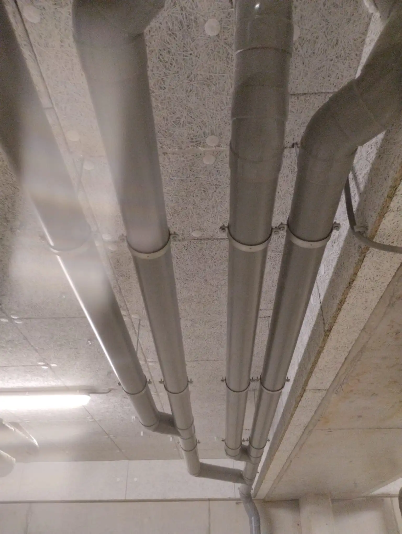 Pipe routing through a wall cavity during installation